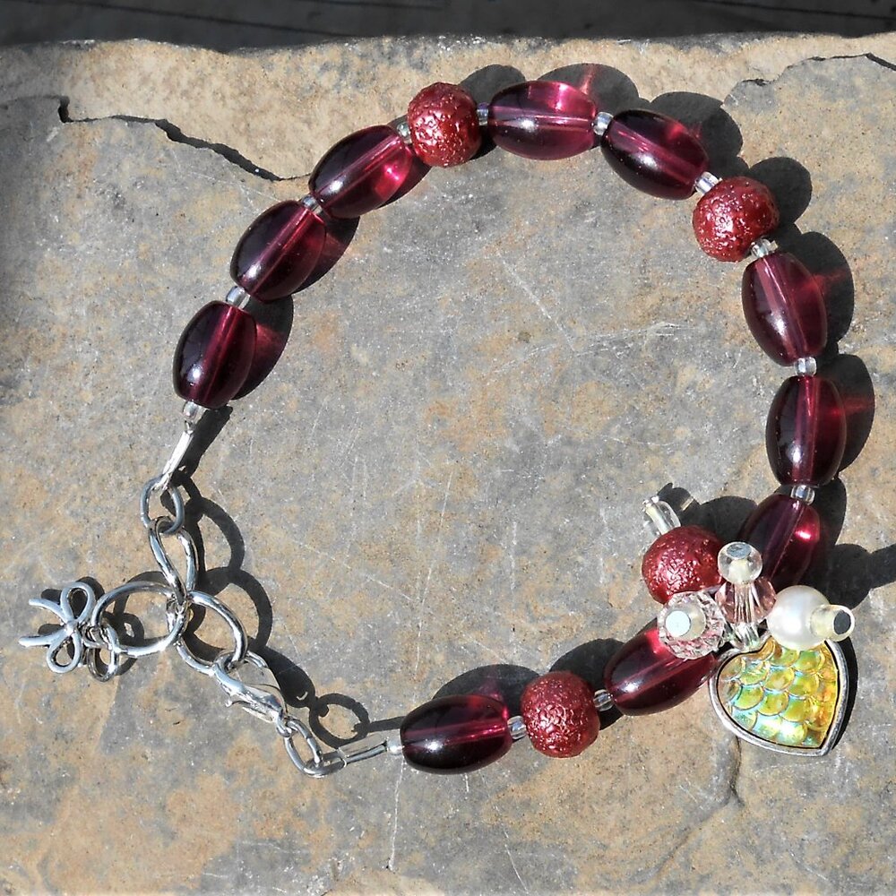 Bracelet with Tibetan silver charm featuring dragon scale inclusion and 8mm and